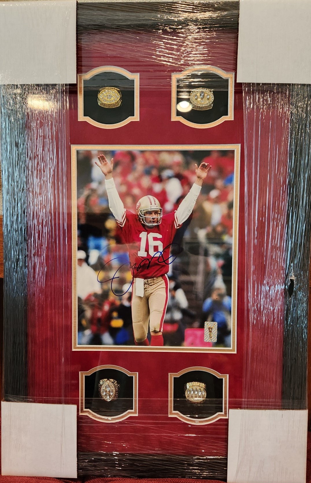 Autographed Joe Montana Custom Framed with 4 replica Super Bowl rings